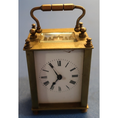 14 - Small brass French eight day carriage clock with key (with beveled glass panels) (front panel missin... 