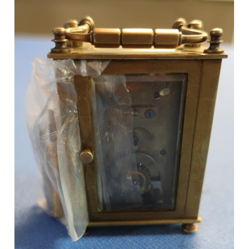 14 - Small brass French eight day carriage clock with key (with beveled glass panels) (front panel missin... 