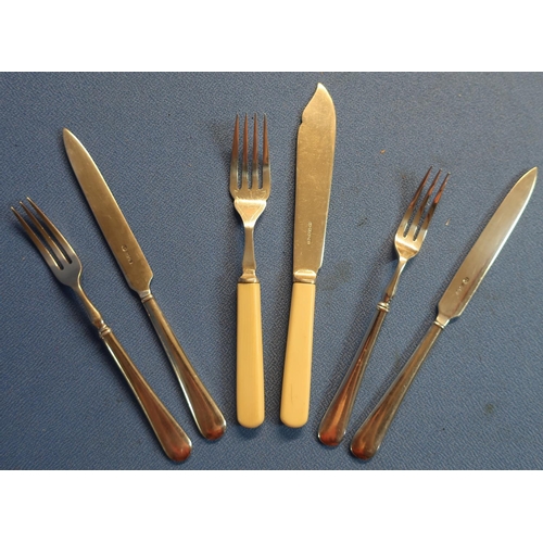 32 - Six pairs of plated fish knives and forks and twelve pairs of dessert knife and forks