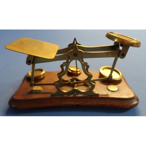 65 - Set of brass postage scales mounted on mahogany plinth stamped 'Warranted Accuracy' with a small sel... 