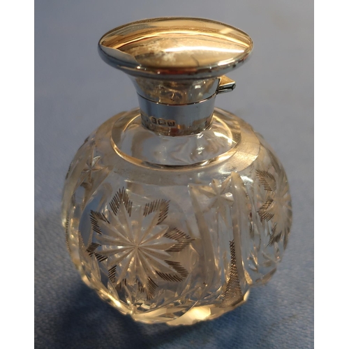 35 - Birmingham 1913 silver hallmarked topped cut glass globe shaped scent bottle (height 9.5cm)