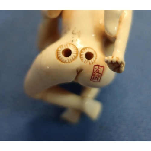 45 - Early 20th C carved ivory erotic Netsuke with signature panel to the buttock (height 4.5cm)