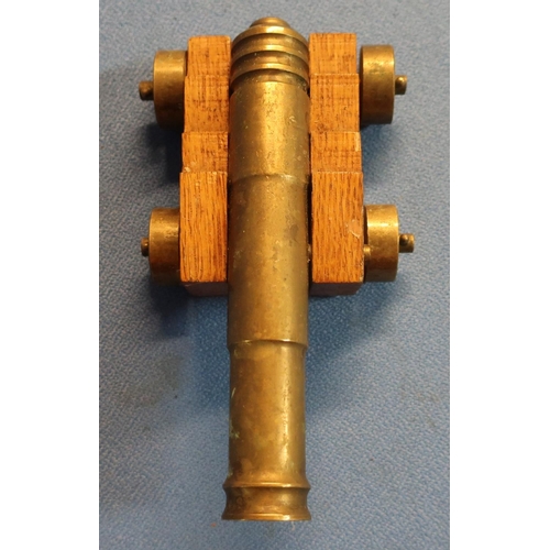 64 - Brass model of a cannon with 15cm staged barrel on oak carriage