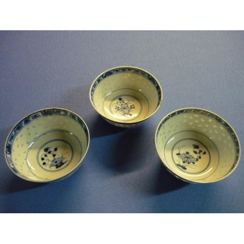 523 - Three Chinese blue & white rice bowls, with various signature panels to the base