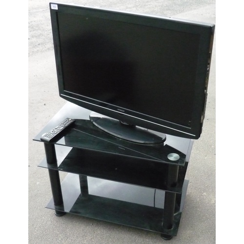 514 - Hitachi 31 inch flat screen TV complete with three tier smoked glass stand