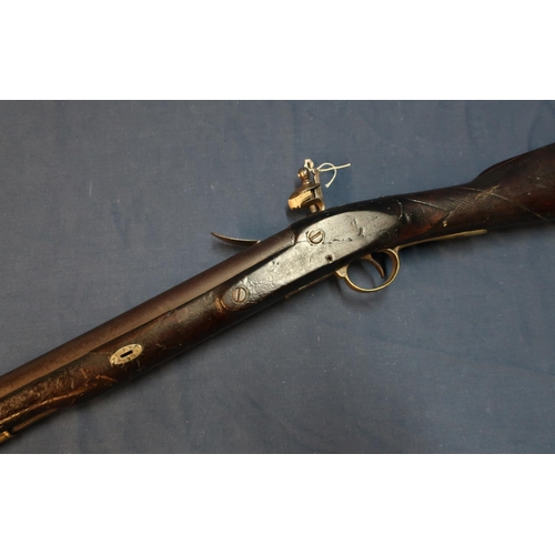 1 - Flintlock carbine, 16 inch barrel with worn proof marks, complete with swivel stirrup ramrod and bra... 
