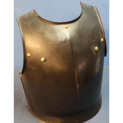 29 - Heavy steel breastplate with brass rivets and mounts, and internal hanging hooks (height 37.5cm)