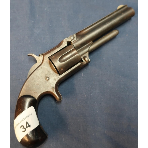 34 - Smith and Wesson .32 rimfire revolver with 3 1/2 inch barrel with engraved details to the top rib an... 