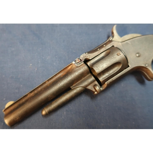 34 - Smith and Wesson .32 rimfire revolver with 3 1/2 inch barrel with engraved details to the top rib an... 