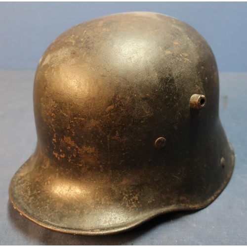 60 - German WWI steel helmet complete with leather liner and padding