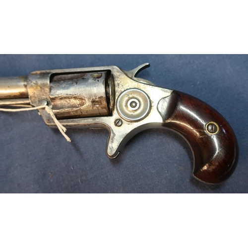 86 - Colt .32 rimfire revolver with 2 1/4 inch barrel, engraved details to the top and two piece wooden g... 