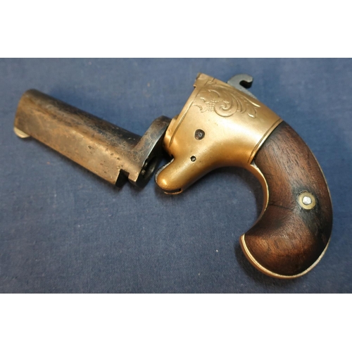 87 - American .41 rimfire Derringer with 2 1/4 inch swivel barrel and two piece wooden grips, serial no. ... 