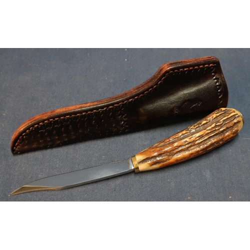 265 - Cock Fighter sheath knife with 3 1/2 inch narrow blade, antler grip and tooled leather sheath