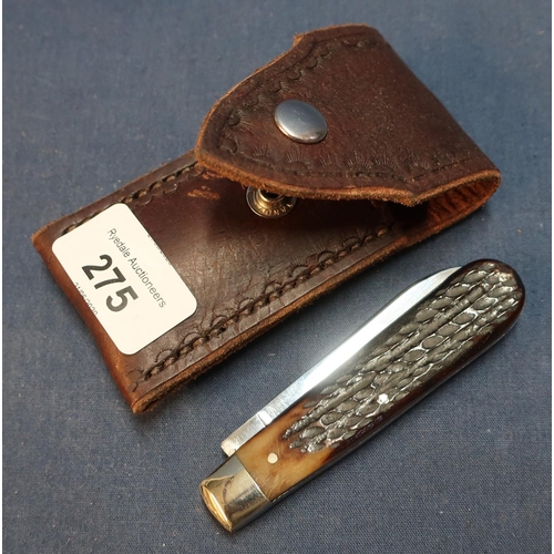 275 - George Wostenholm of Sheffield single bladed pocket knife with two piece lambs foot grips and leathe... 