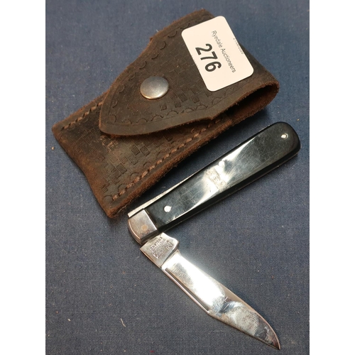 276 - I.XK George Wostenholm of Sheffield single bladed pocket knife with two piece grips and leather belt... 