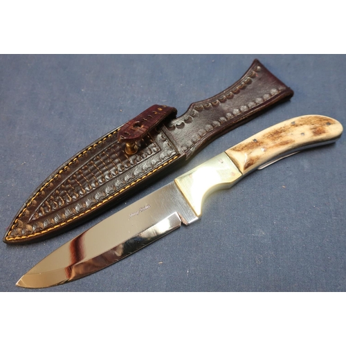 279 - Harry Bowden knife with 4 1/2 inch blade, brass mounts and two piece horn grip, complete with tooled... 