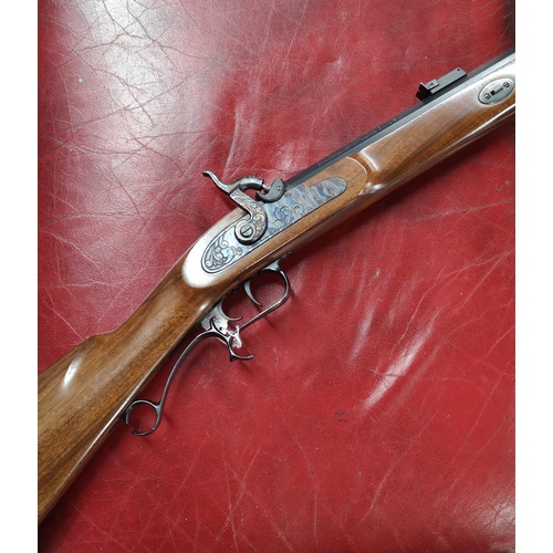 646 - Thompson Centre Arms .54 muzzle loading black powder rifle, serial no. 36735, with a selection of ac... 