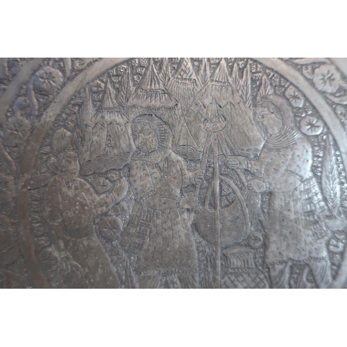 126 - Pewter charger, the centre of the charger depicting native eastern scenes, and two brass chargers (3... 