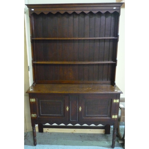 175 - Oak dresser with two tier raised back and two panelled cupboard doors to the base, with brass lock p... 
