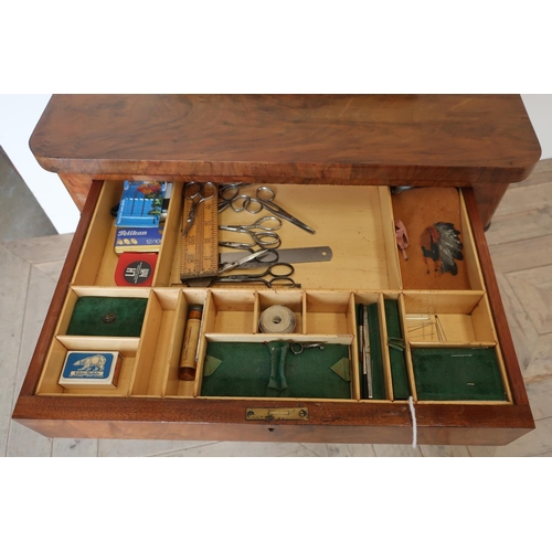 101 - Victorian walnut combination games and sewing table, with revolving fold-out top with inset chess bo... 