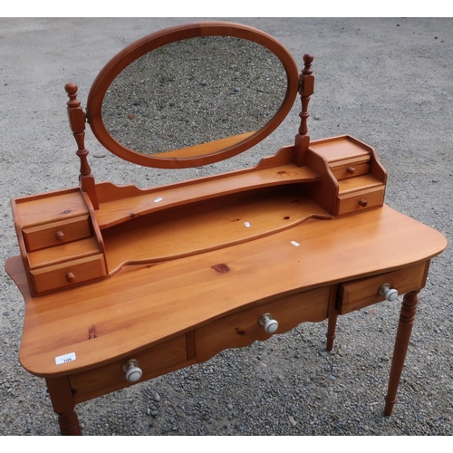 106 - Modern pine dressing table with raised mirror back and three drawers, on turned supports (width 111c... 