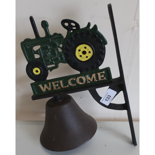 133 - Cast metal wall hanging bell with tractor figure