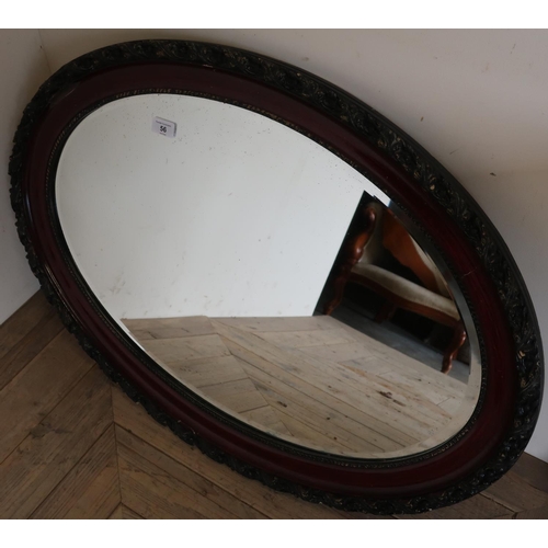 56 - Pair of oval bevel edged wall mirror with carved frames (84cm x 62cm) (2)