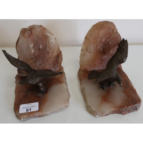 81 - Pair of rough cut onyx style bookends with cast metal figures of eagles with outstretched wings