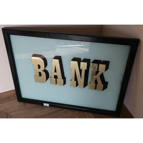 87 - Ebonised framed 'Bank' glass sign (54cm x 74cm)
