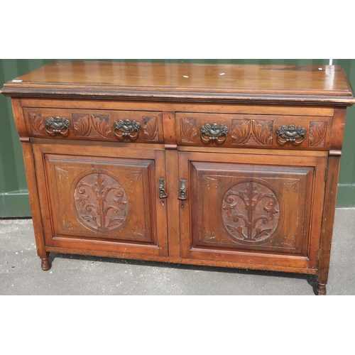 91 - Late Victorian mahogany sideboard with two drawers above two cupboard doors with carved and panelled... 
