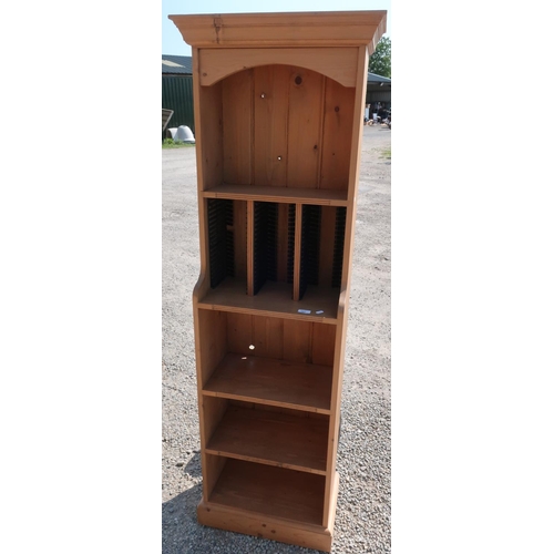 287 - Free standing pine bookcase/CD rack (48cm x 28cm x 173cm)