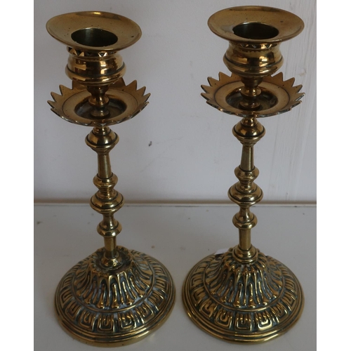 36 - Pair of late 19th C brass candlesticks with embossed detail (height 20cm)