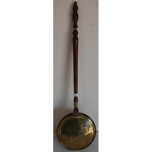 43 - 19th C copper bedwarming pan with engraved detail and turned wood handle (overall length 107cm)