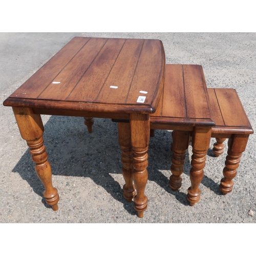 291 - Nest of three hardwood occasional tables on turned supports