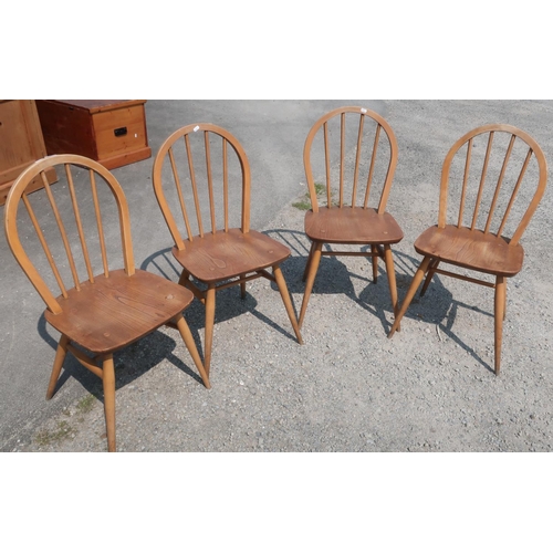 292 - Set of four light elm Ercol stick back dining chairs with H shaped understretcher