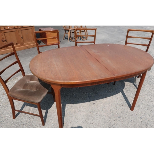 295 - Macintosh teak extending dining table and set of four chairs (for reupholstery)