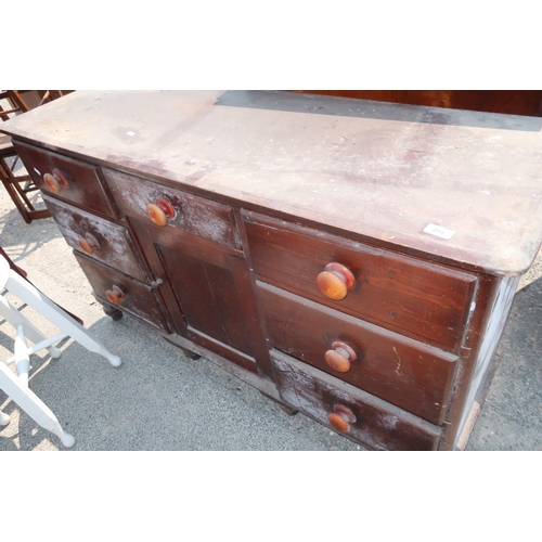 300 - Victorian stained pine sideboard with central drawer above panelled cupboard door flanked by six sho... 