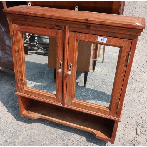 305 - Waxed pine wall cupboard enclosed by two mirror panelled doors, above open shelf (64cm x 16cm x 72cm... 