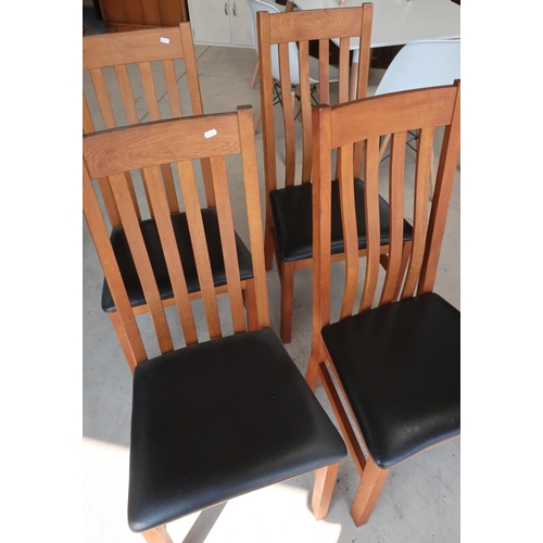 310 - Set of four modern oak slat back dining chairs with leather upholstered seats