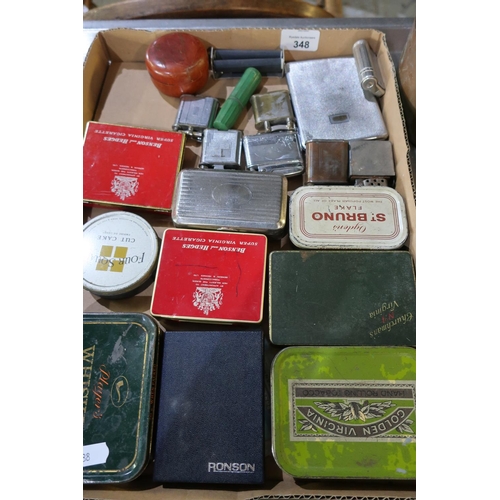 348 - Box containing a selection of various assorted lighters, tobacco tins, boxed Ronson electronic light... 