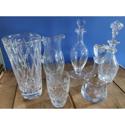 355 - Three glass decanters, large etched glass water jug and two cut glass vases