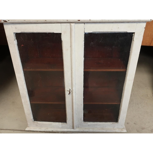 405 - Victorian painted pine cupboard enclosed by two glazed doors (70cm x 24.5cm x 70cm)