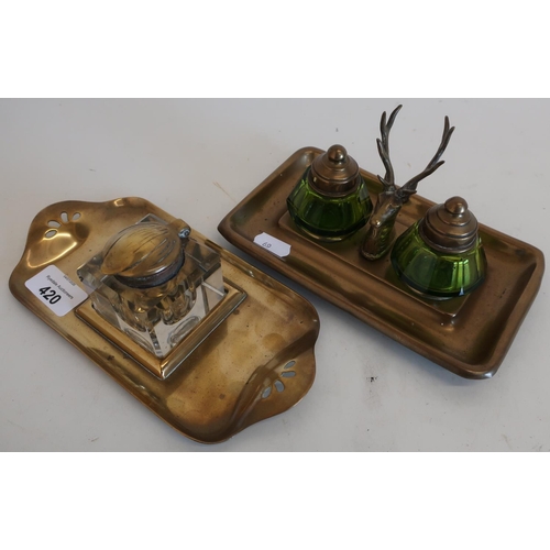 420 - Brass topped glass inkwell on brass twin handled tray and another double inkwell with stags head sta... 