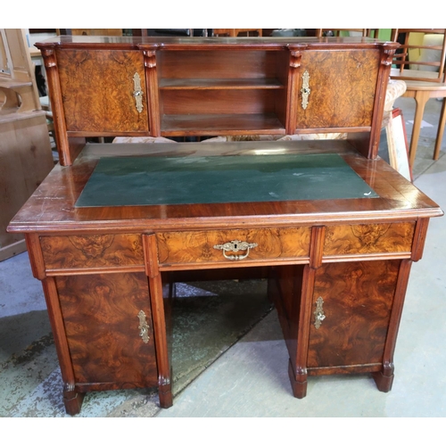 304 - Victorian walnut desk, the raised back with two tier open centre flanked by two panelled cupboard do... 