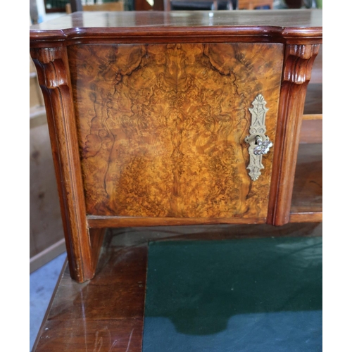 304 - Victorian walnut desk, the raised back with two tier open centre flanked by two panelled cupboard do... 