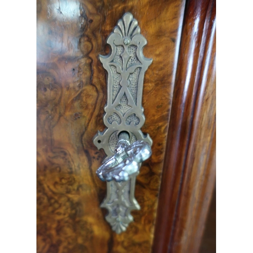 304 - Victorian walnut desk, the raised back with two tier open centre flanked by two panelled cupboard do... 