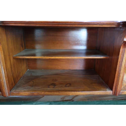 304 - Victorian walnut desk, the raised back with two tier open centre flanked by two panelled cupboard do... 