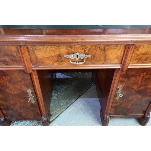 304 - Victorian walnut desk, the raised back with two tier open centre flanked by two panelled cupboard do... 