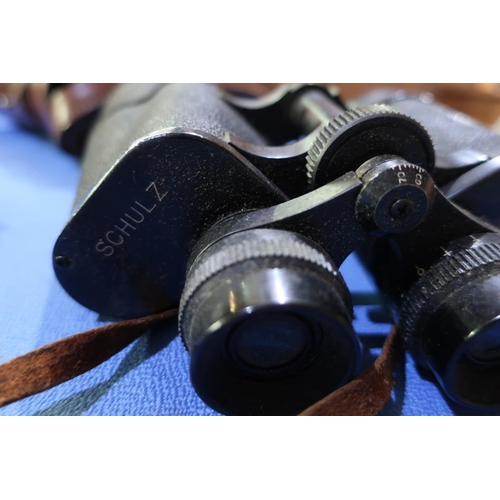 320 - Cased pair of military type binoculars by Taylor 1941,no. MKII and two other pairs of binoculars