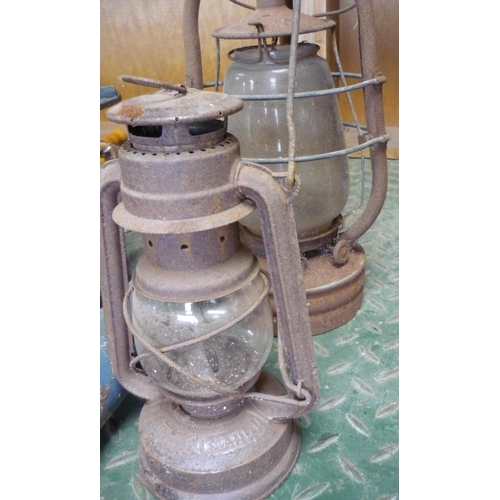 47 - Three hurricane lamps of various styles